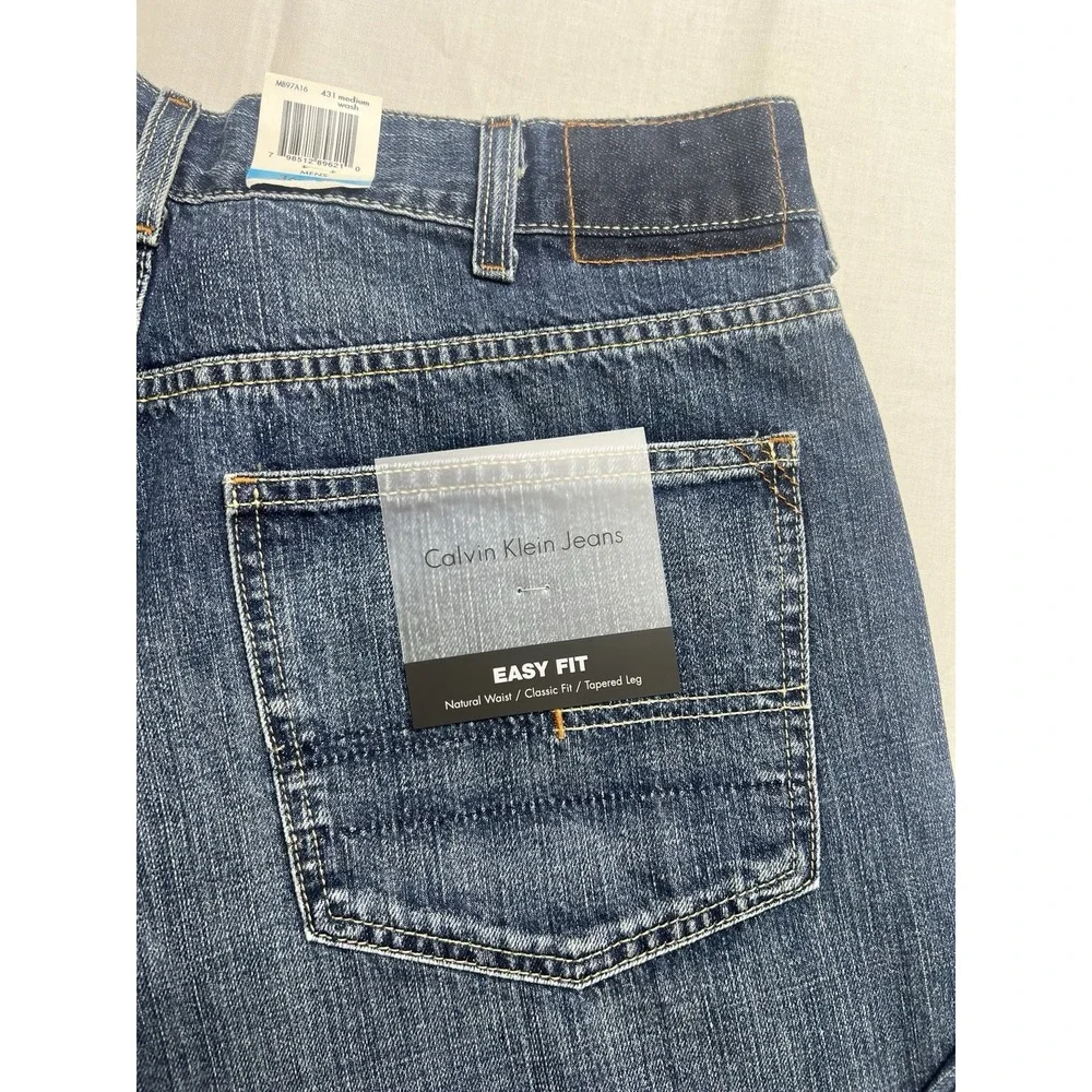 Calvin Klein Men's Jeans 36x32‎ Easy Fit Tapered leg Medium Wash Cotton